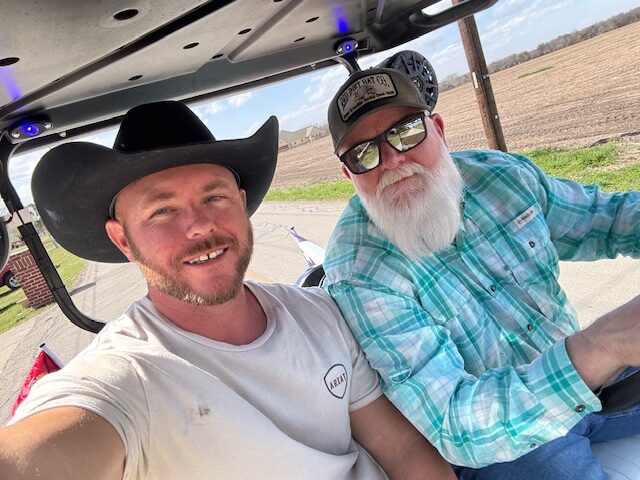 Two men taking a selfie outdoors at Hidden Pastures Adult Farm Club